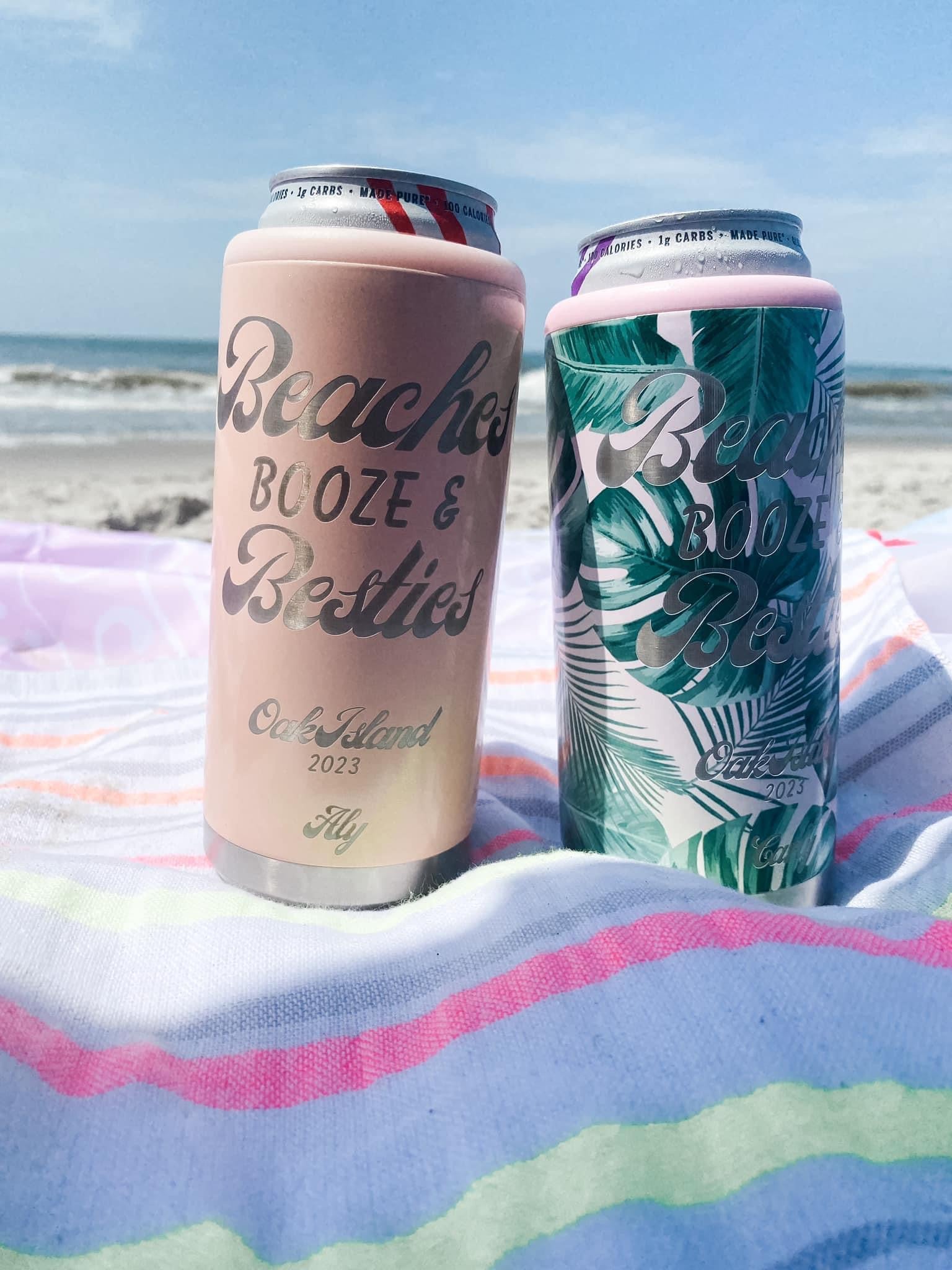 Engraved slim can coolers on the beach.